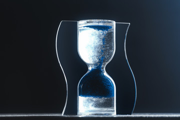 Hourglass on dark background