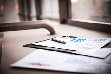 Fototapeta premium Drawings and charts of successful business, workplace of the businessman