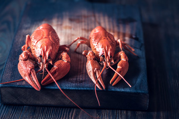 Boiled crayfish on the wooden board
