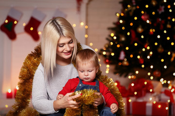 Fototapeta na wymiar Mother and son celebrate christmas at home