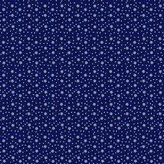 Seamless pattern. Christmas snowflake pattern on a blue background paper for scrapbooking