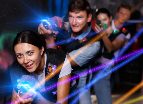 Group young people playing laser tag  game