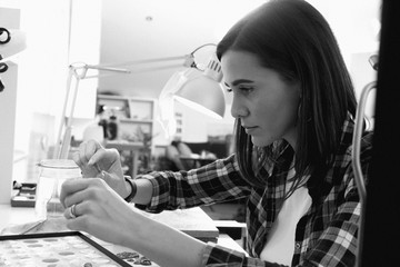 Jeweler at work, crafting in a jewelery workshop.