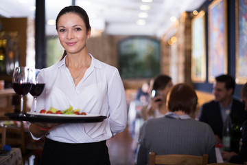 Waitress standing in restaurant
