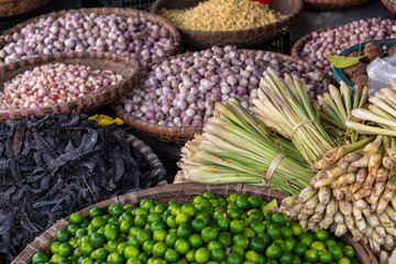 Fresh vegetables and fruits in traditional street market in Hanoi, Vietnam.