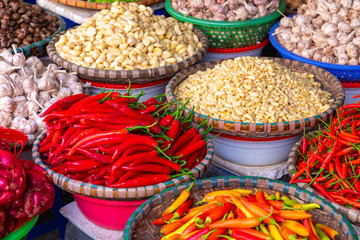 Fresh vegetables and fruits in traditional street market in Hanoi, Vietnam.