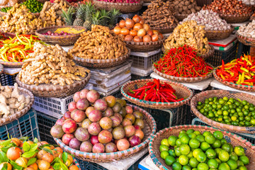 Fototapeta na wymiar Fresh vegetables and fruits in traditional street market in Hanoi, Vietnam.
