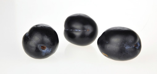 plums on white background