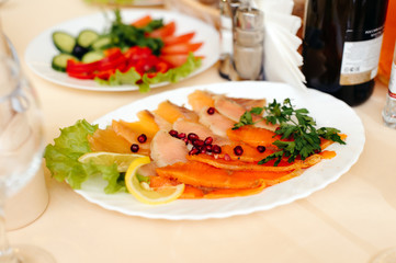 Sliced red fish on the banquet table