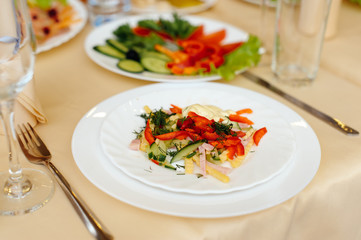 A plate of salad at the banquet table