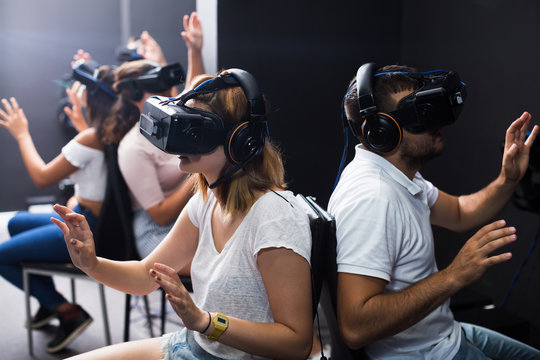 People wearing virtual reality goggles