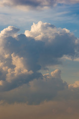 Landscape with dramatic light - beautiful golden sunset with saturated sky and clouds.