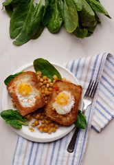Toast with egg in white plate on white marble background. Healthy breakfast