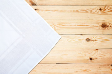 Old vintage wooden table with white tablecloth. Top view mockup.