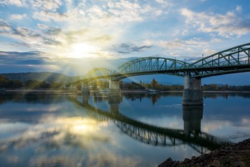 Amazing view of Maria Valeria bridge with reflection in Danube river, Esztergom, Hungary at sunrise
