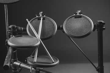 Drum sticks are on the electronic drum. Theme music.          