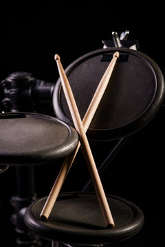 Drum sticks are on the electronic drum. Theme music.          