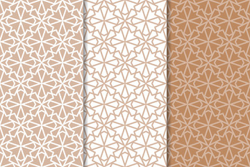 Brown and white geometric ornaments. Set of seamless patterns