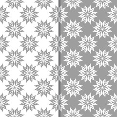 White and gray floral backgrounds. Set of seamless patterns
