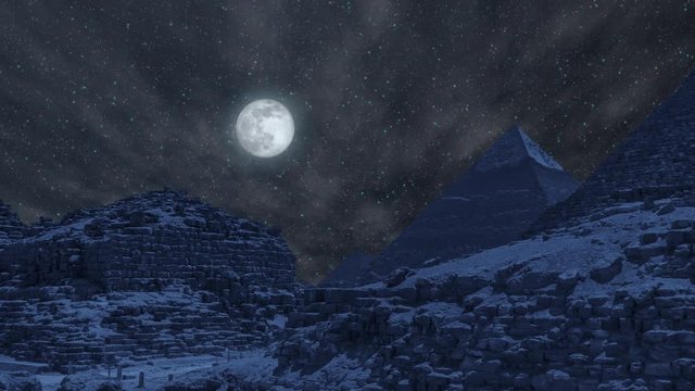 Night Time lapse Of The Great Pyramids In Giza Valley with full moon - Cairo, Egypt. Zoom out effect