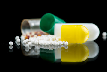 Contents of the capsule with the drug, multi-colored and white microgranules