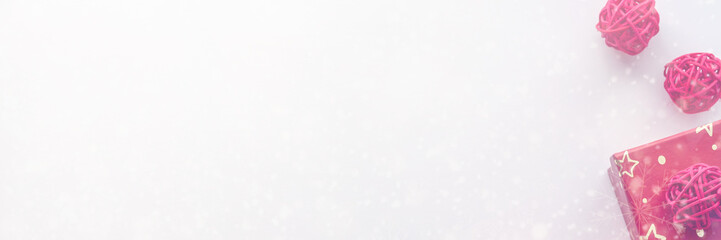 Panoramic photo of copy space with snowflakes, red rattan balls and Christmas presents in golden stars