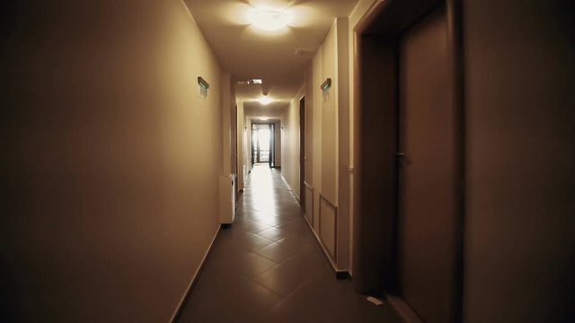 Moving Camera, Walk In Hotel Corridor, Point Of View. POV. Walking Through Hotel Corridor. Interior Gimbal Shot. First Person View