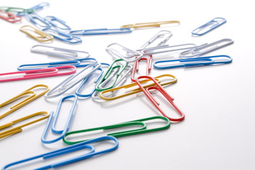 Colorful pishpins on white. Office supplies on white.