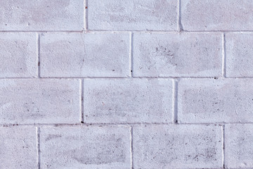 Detail of an old block wall painted white