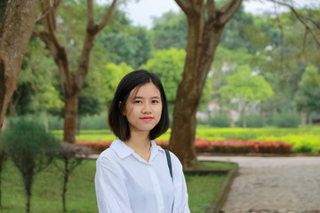 portrait of young woman at a park in Vietnam