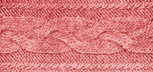 Light red knitwear fabric with pigtail, knitted wool texture of jersey.