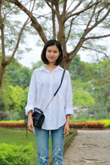 portrait of young woman at a park in Vietnam