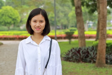 portrait of young woman at a park in Vietnam