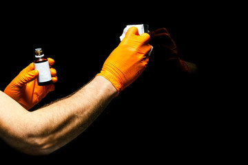 Car polish wax worker hands polishing car. Buffing and polishing vehicle with ceramic. Car...