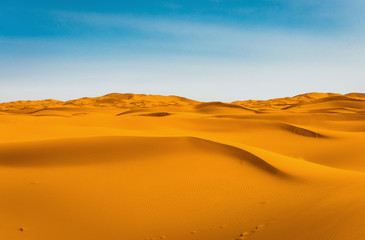Fototapeta na wymiar Majestic beautiful scene of Merzouga dunes of Sahara desert Morocco