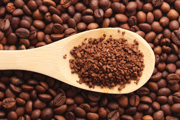 instant coffee in a spoon and coffee beans. Coffee, coffee drinks.
