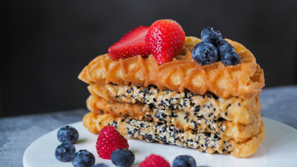 Waffles With Strawberry and Blue Berry in white plate.