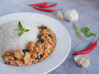 Thai Stir-Fried chicken with basil with raw materials are basil leaves, red chili and garlic. Still life image. Thai food concept.