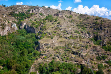 beautiful canyon at Khndzoresk cave settlement (13th-century, used to be inhabited till the 1950s) with a suspension bridge underneath, Syunik region, Armenia