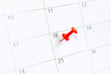 calendar with Red color pin thumbtack in 18th day . Save the Date. concept organization of working time