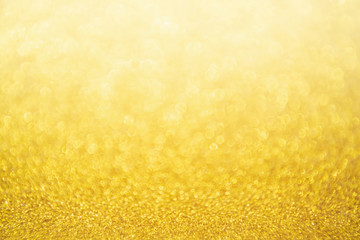 Abstract Gold glitter festive Christmas texture background blur with bokeh light