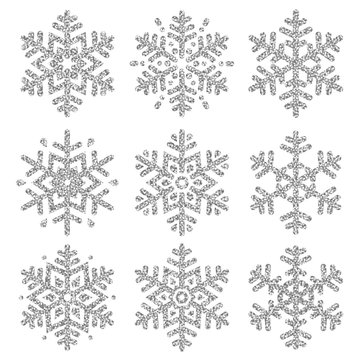 Set of silver glittering snowflakes  over white backgrounds, vector illustration