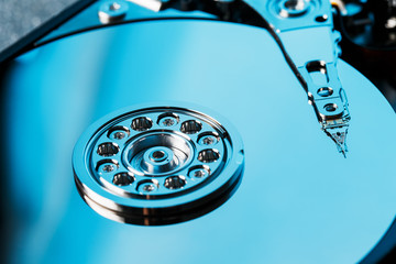 Disassembled hard drive from the computer, hdd with mirror effect. Opened hard drive from the...