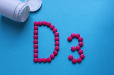 the letter D 3 is lined with pills