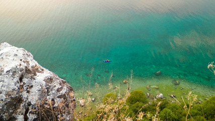 Naklejka na ściany i meble Canoeing in beautiful water of Lake Ohrid. Nature background.