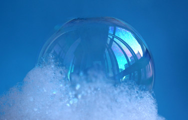 Naklejka na ściany i meble Transparent soap bubbles of a blue shade