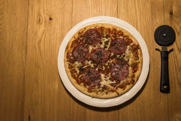 Pizza on the woodan table.