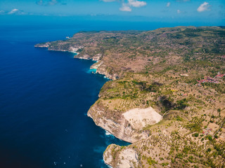 Fototapeta na wymiar Coastline and blue ocean in Nusa Penida. Aerial drone view of tropical island