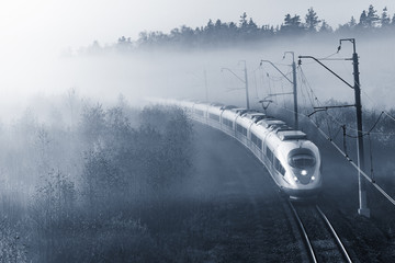 Modern high-speed train approaches to the station.