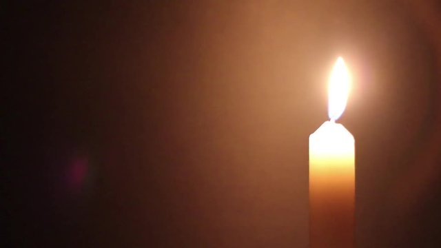 candle burns in the dark
